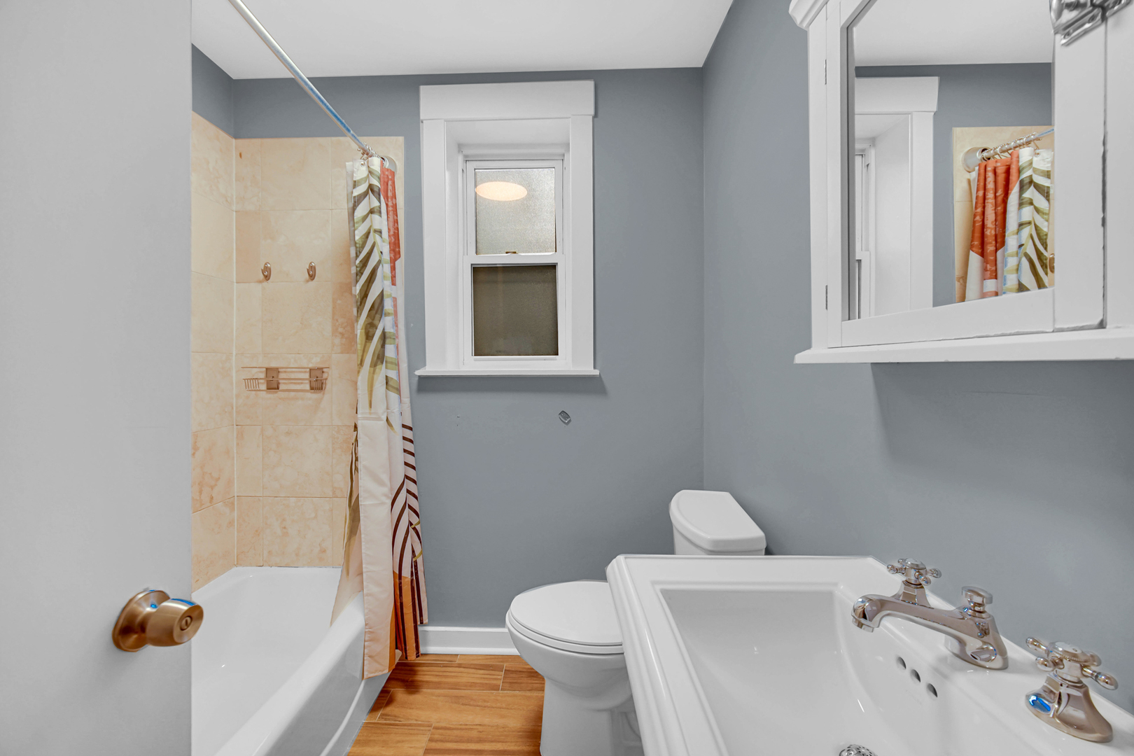 4343 North Sacramento Avenue, Unit AG Chicago, IL 60618 - Photo 21 of 27 a bathroom with a sink a toilet and shower