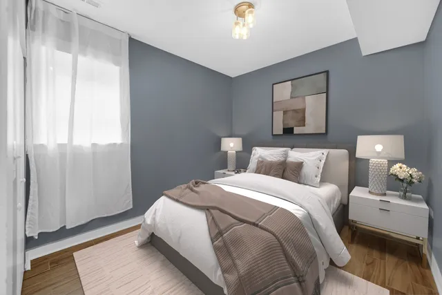 a bedroom with a bed and a mirror