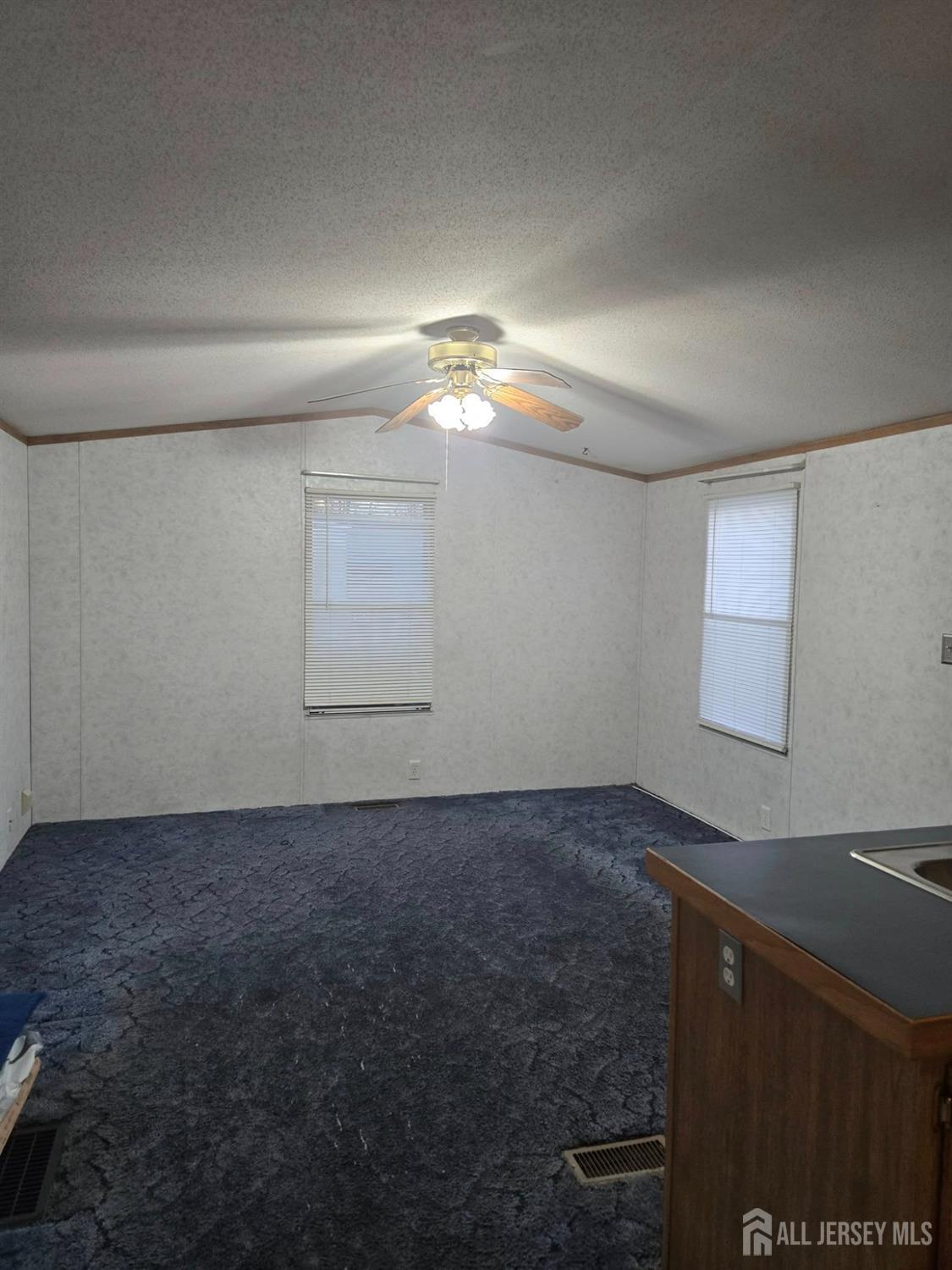 8 3rd Street Avenel, NJ 07001 - Photo 4 of 10 a view of an empty room and window