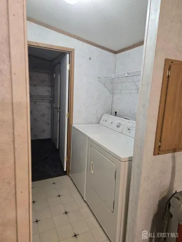 a utility room with a sink a washer and dryer