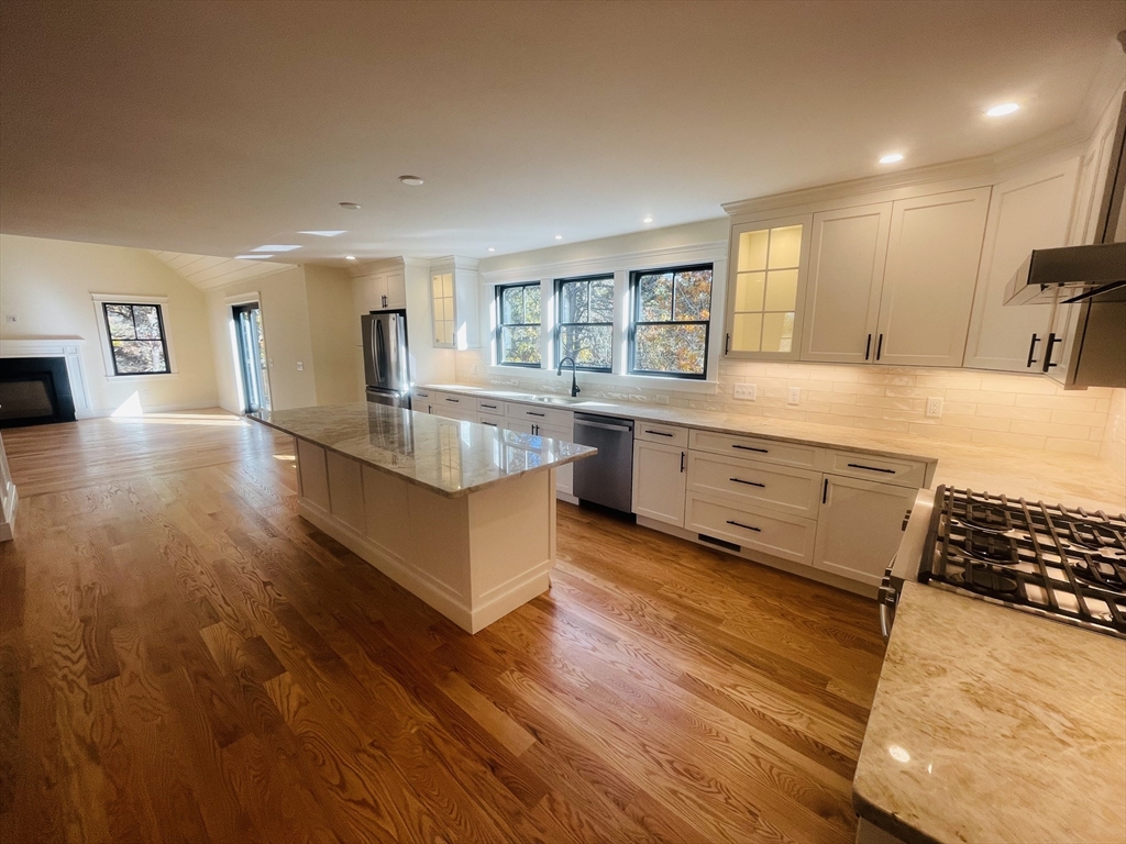 4 Resolution Road Truro, MA 02666 - Photo 11 of 39 a large kitchen with kitchen island a large counter top space and stainless steel appliances