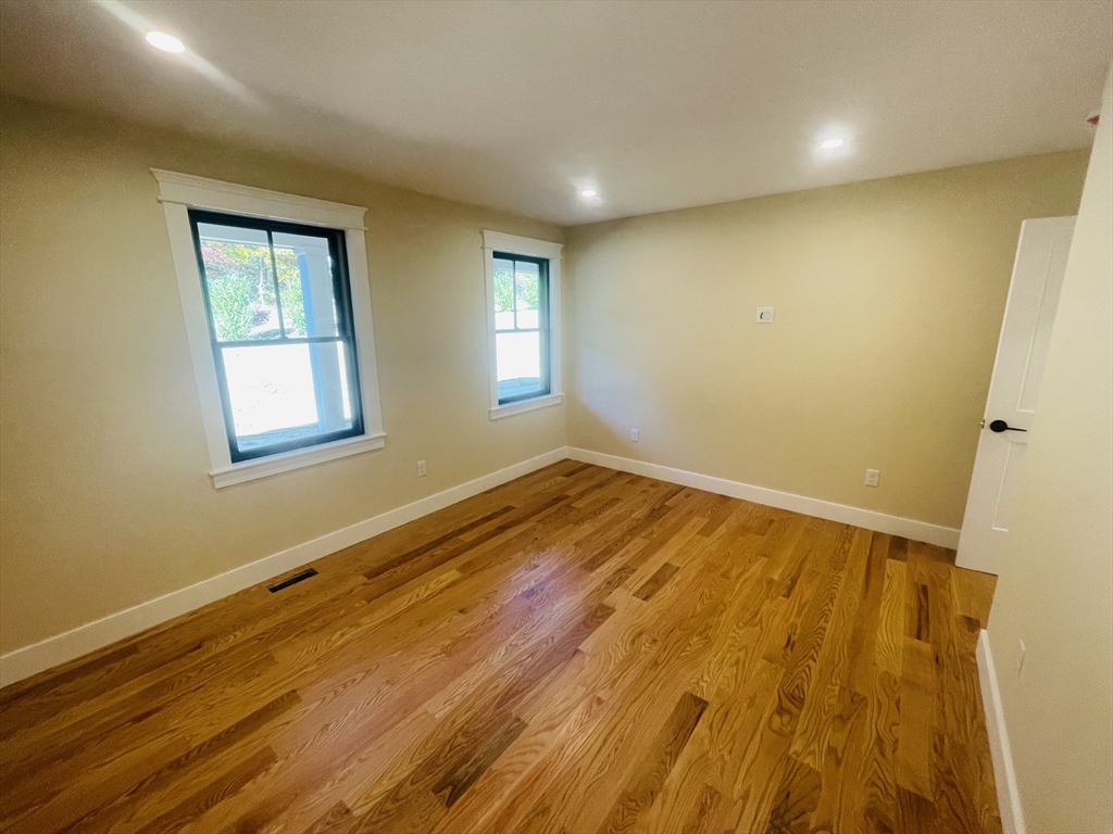 4 Resolution Road Truro, MA 02666 - Photo 16 of 39 a view of an empty room with wooden floor and a window