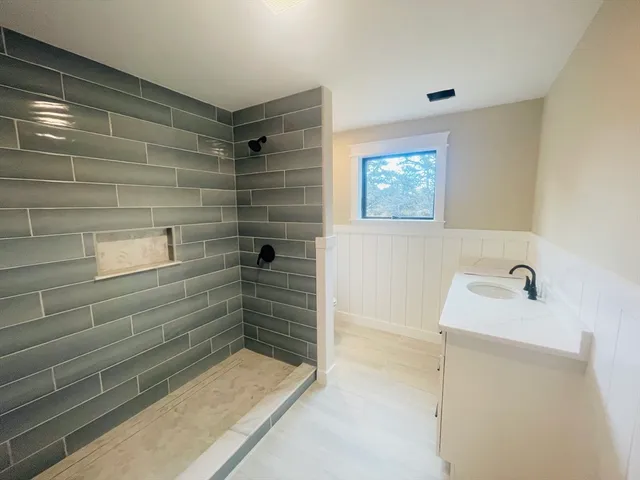 a bathroom with a bathtub and shower