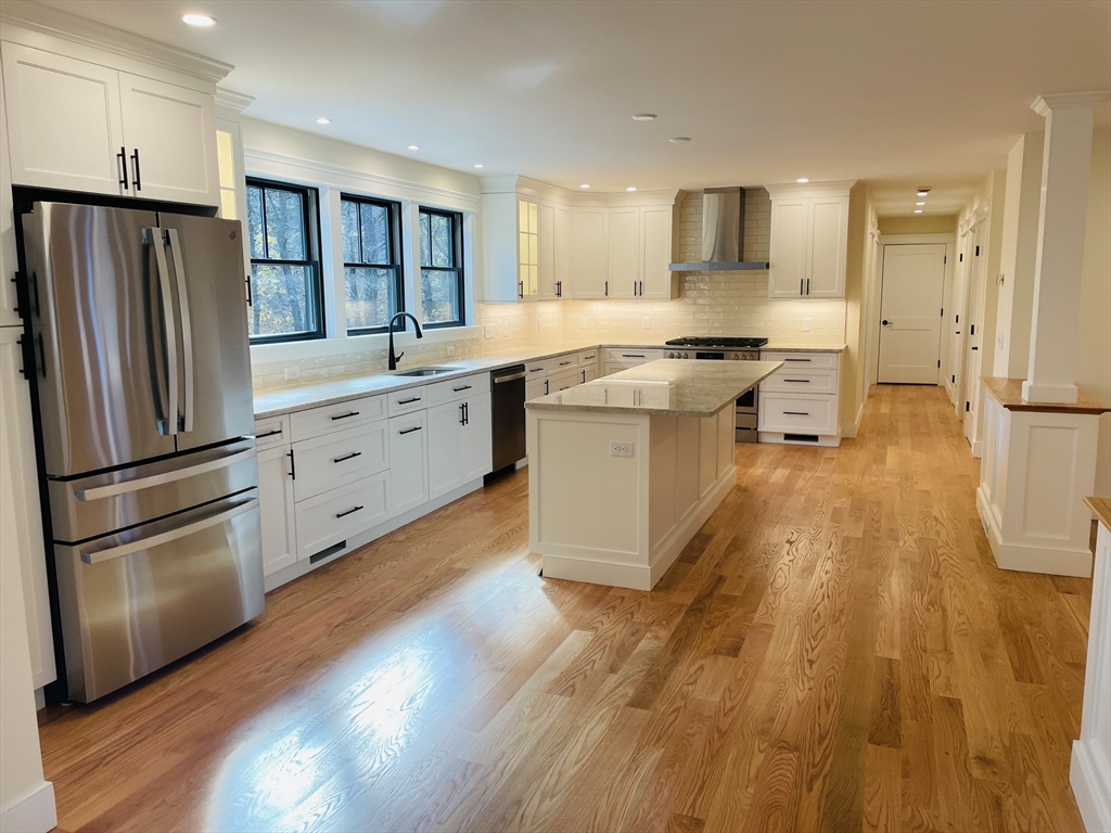 4 Resolution Road Truro, MA 02666 - Photo 9 of 39 a kitchen with stainless steel appliances a refrigerator sink and cabinets