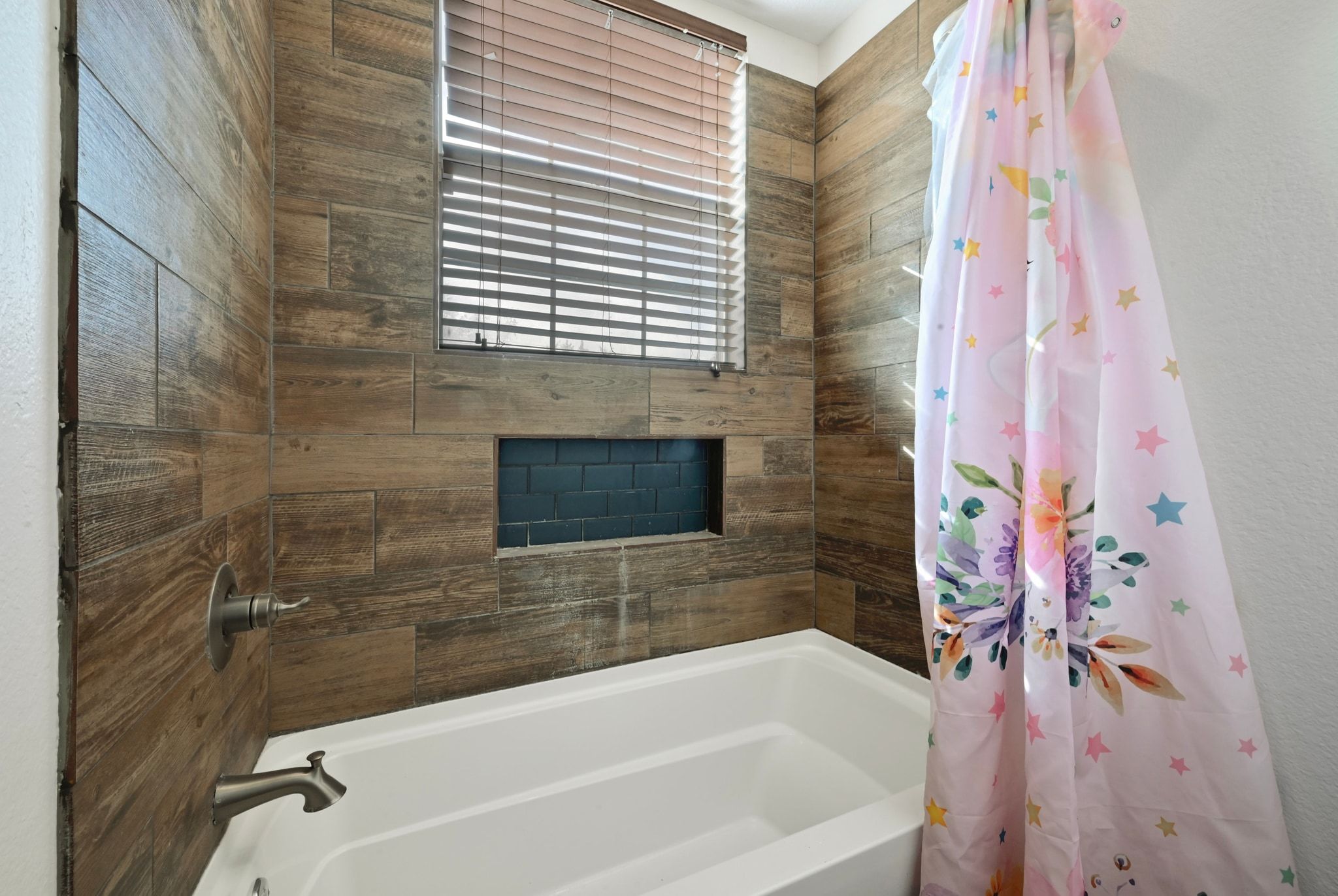 201 Comanche Camp Kyle, TX 78640 - Photo 20 of 37 a bathroom with a bathtub and a shower