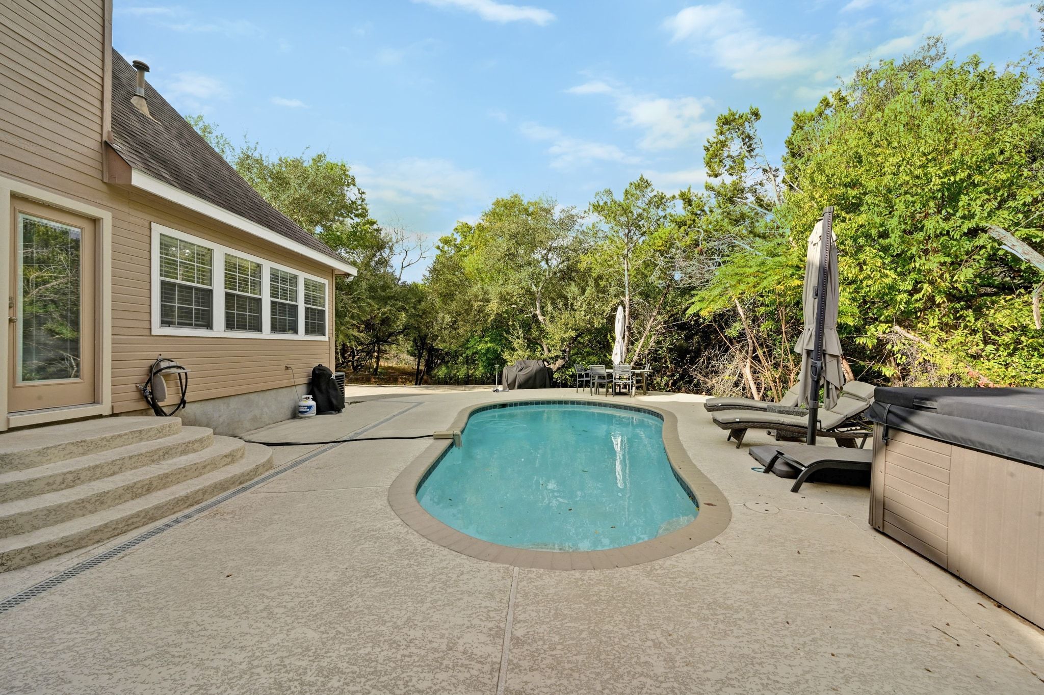 201 Comanche Camp Kyle, TX 78640 - Photo 25 of 37 a view of a backyard with swimming pool