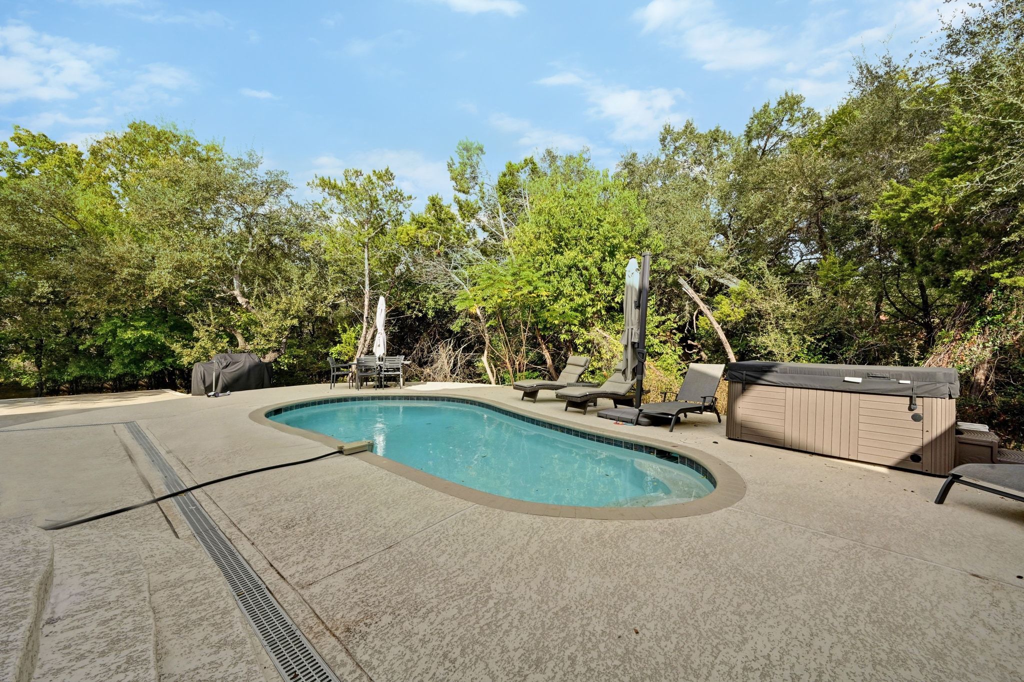 201 Comanche Camp Kyle, TX 78640 - Photo 26 of 37 a view of a swimming pool with a yard and sitting area