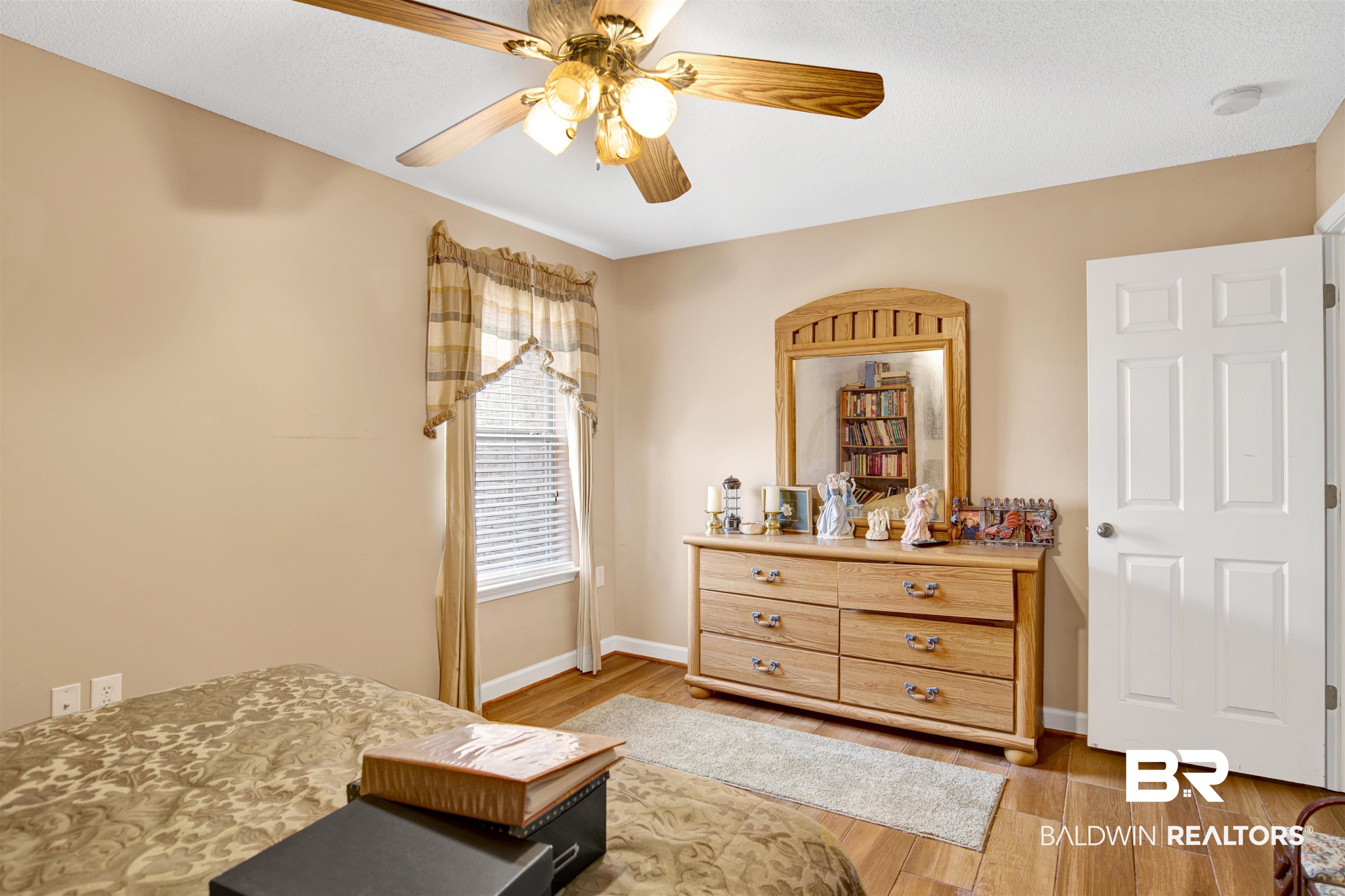 36434 Alexandria Trail Stapleton, AL 36578 - Photo 14 of 27 Bedroom with light wood-style floors and a ceiling fan