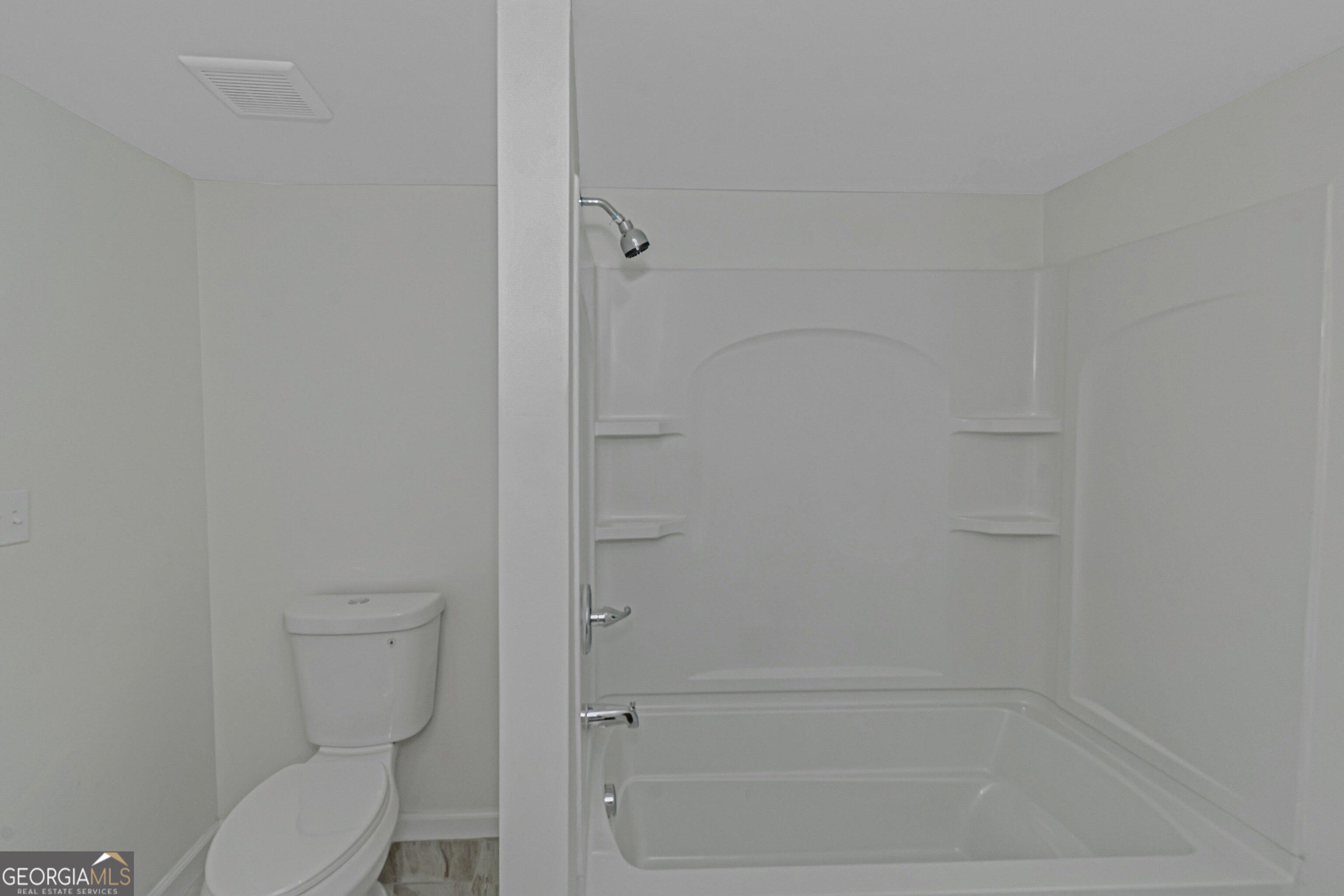 204 Mill Street Barnesville, GA 30204 - Photo 23 of 35 a bathroom with a toilet and shower