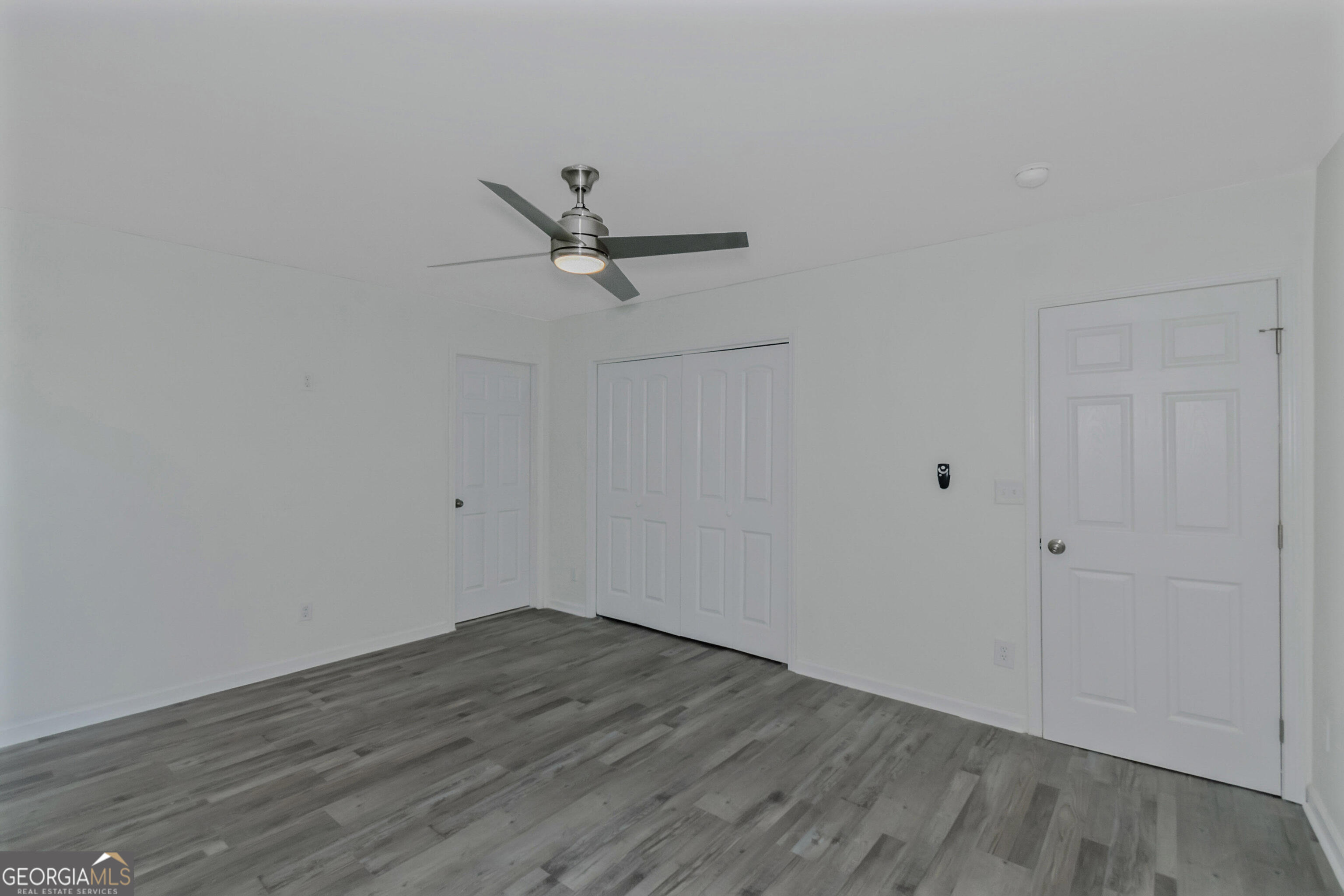 204 Mill Street Barnesville, GA 30204 - Photo 27 of 35 a view of a big room with wooden floor and closet