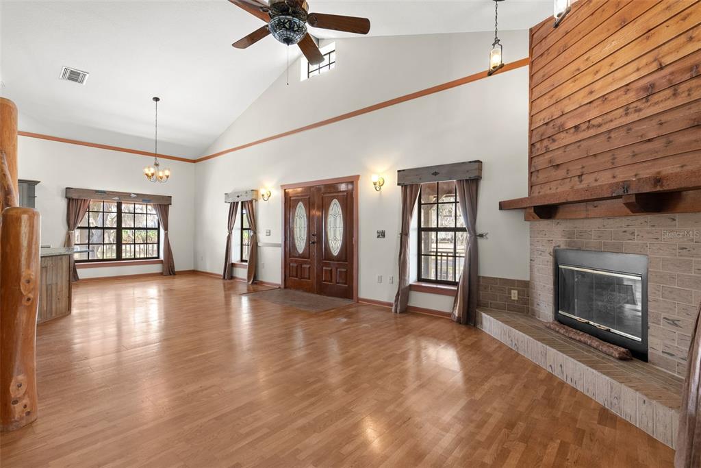 17620 North Poyner Road Polk City, FL 33868 - Photo 12 of 46 a view of a livingroom with a fireplace window and wooden floor