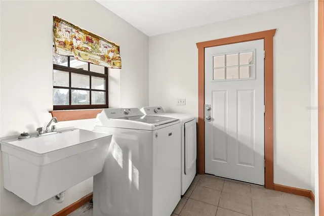 an empty room with closet and a chandelier fan