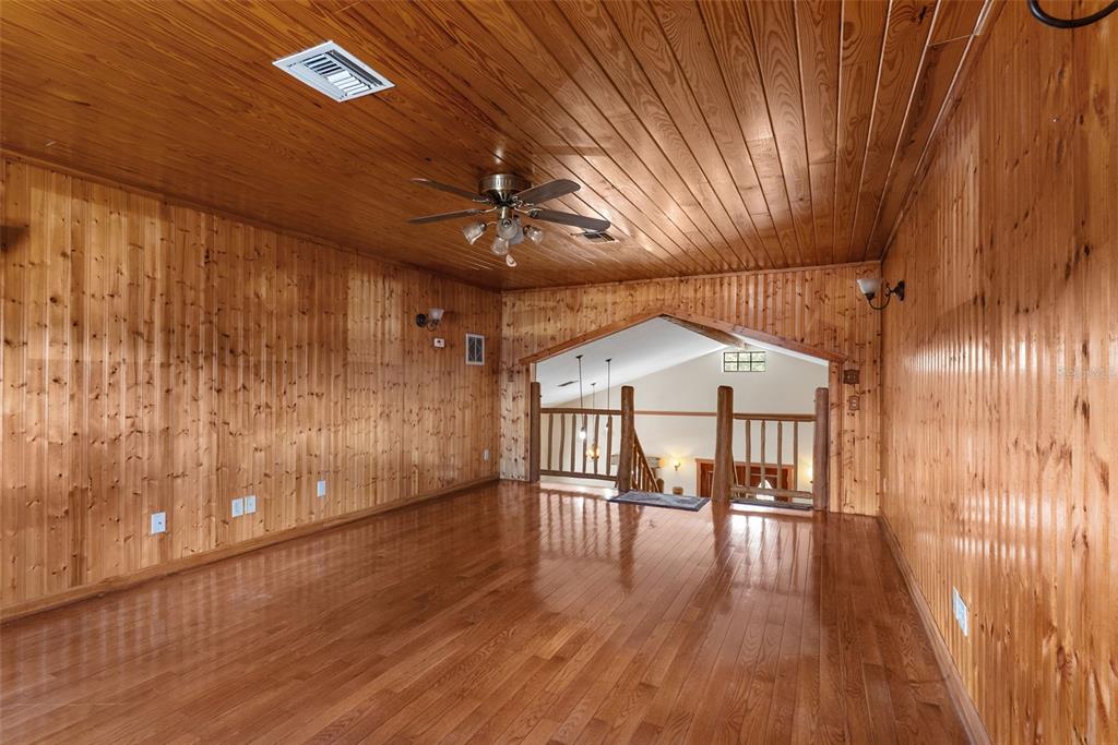 17620 North Poyner Road Polk City, FL 33868 - Photo 22 of 46 a view of a hallway with wooden floor