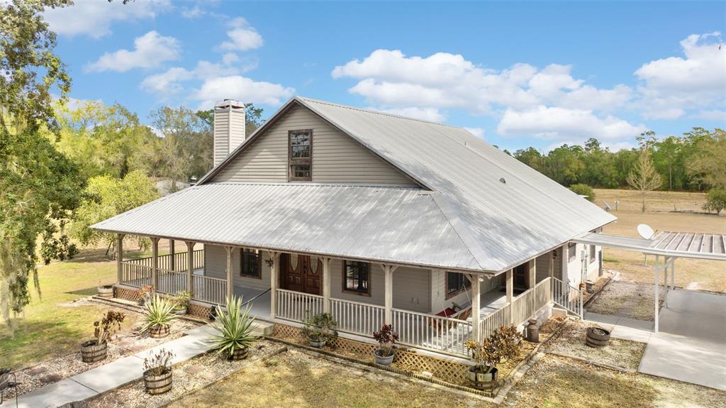 17620 North Poyner Road Polk City, FL 33868 - Photo 4 of 46 a aerial view of a house with a yard