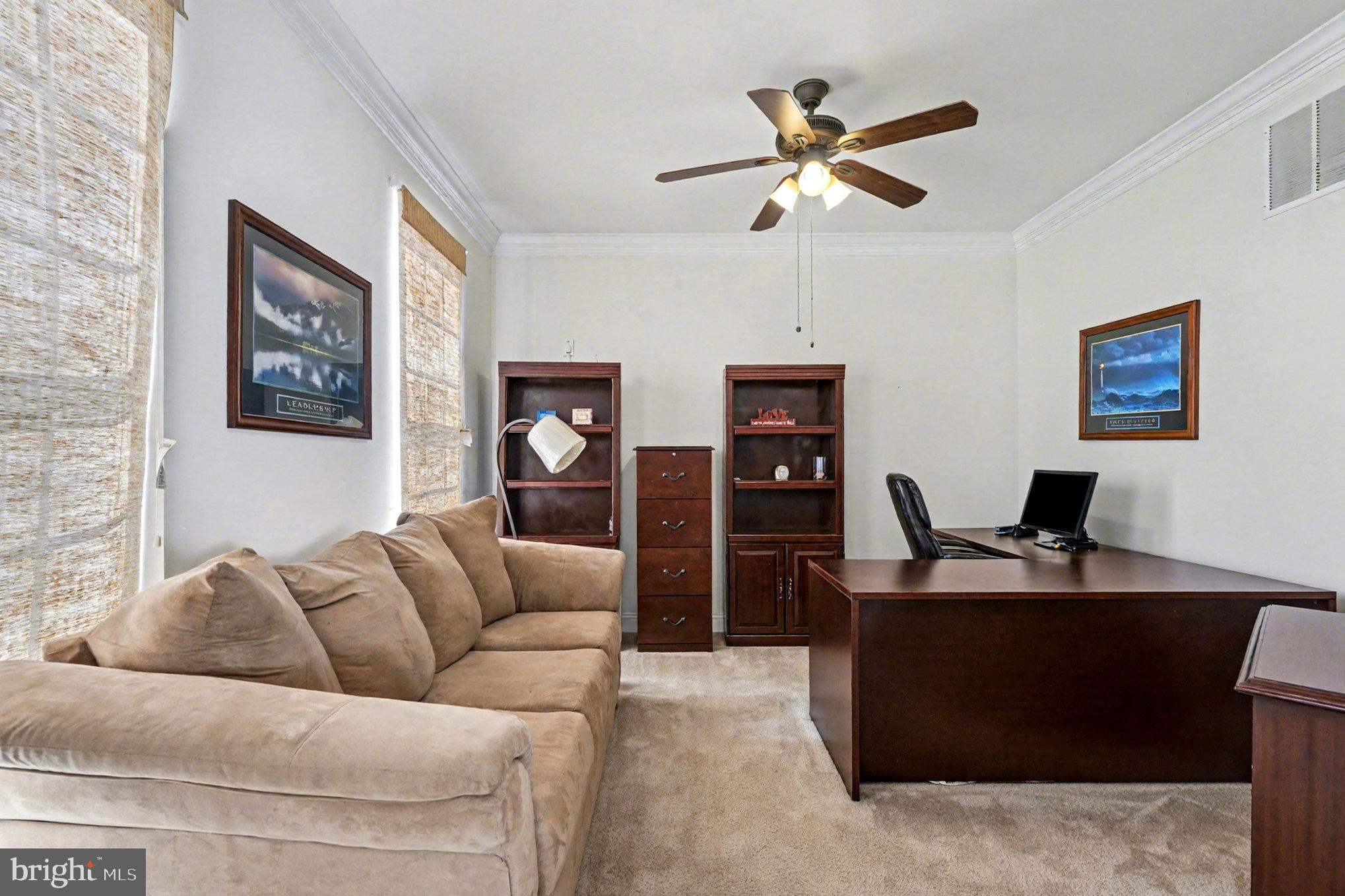 3320 McCorkle Court Triangle, VA 22172 - Photo 13 of 32 a living room with furniture and a ceiling fan