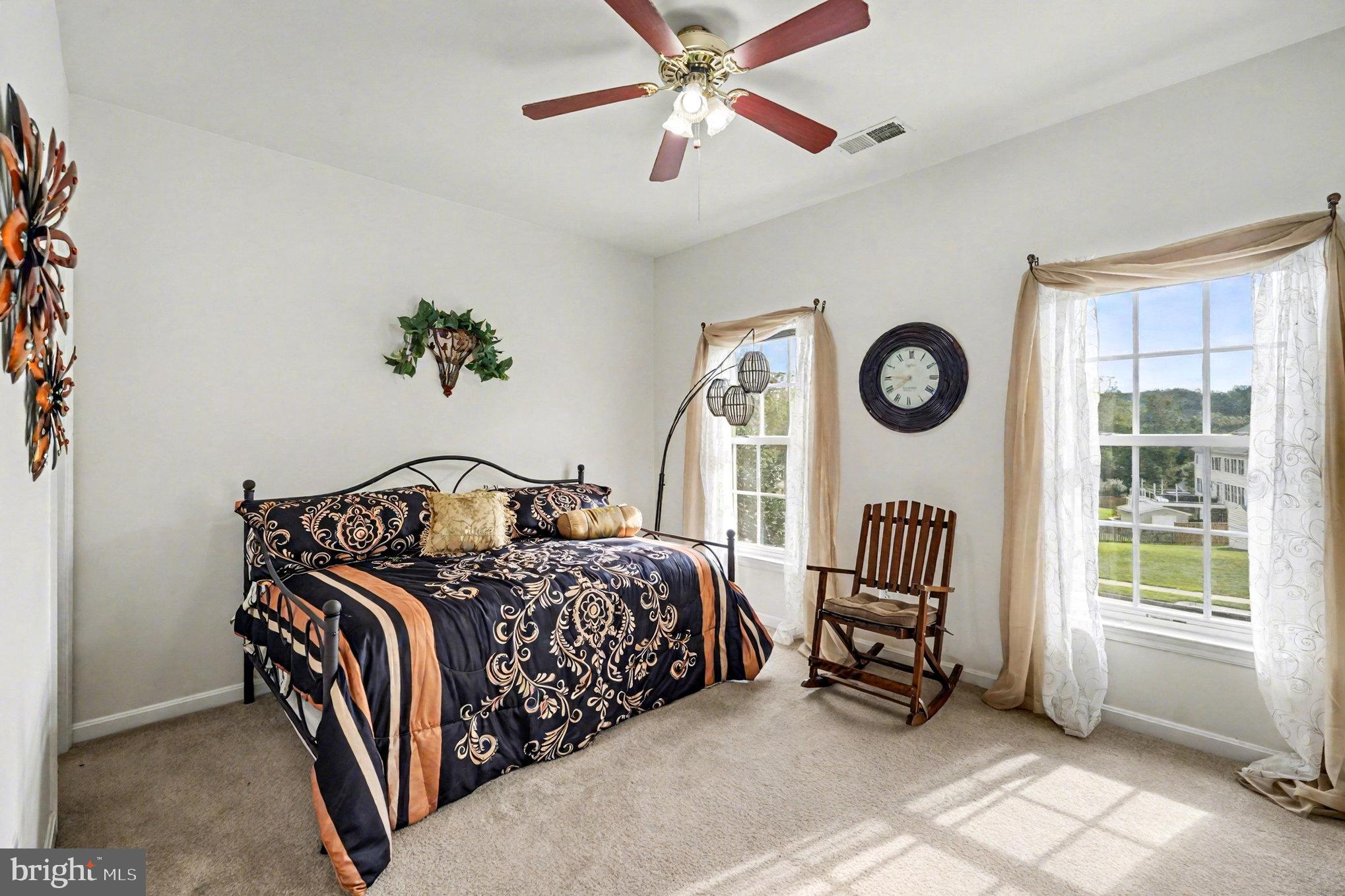 3320 McCorkle Court Triangle, VA 22172 - Photo 17 of 32 a bedroom with a bed and a window
