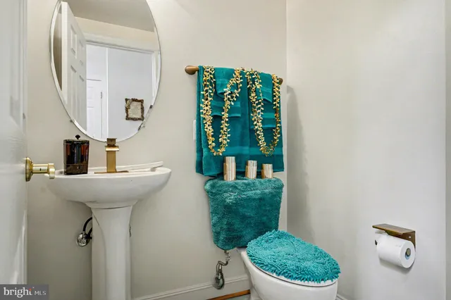 a bathroom with a toilet and a sink