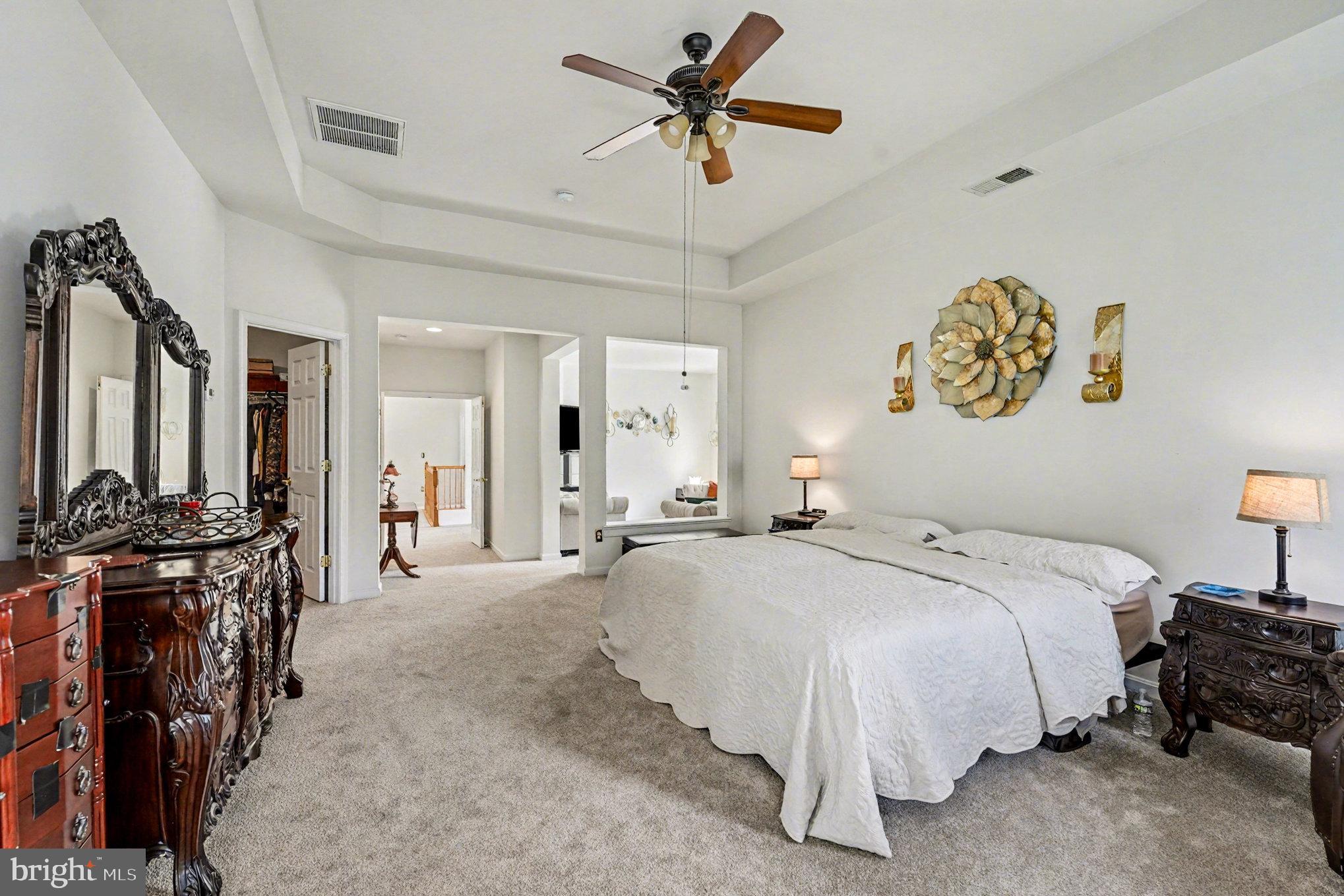 3320 McCorkle Court Triangle, VA 22172 - Photo 21 of 32 a spacious bedroom with a bed and ceiling fan
