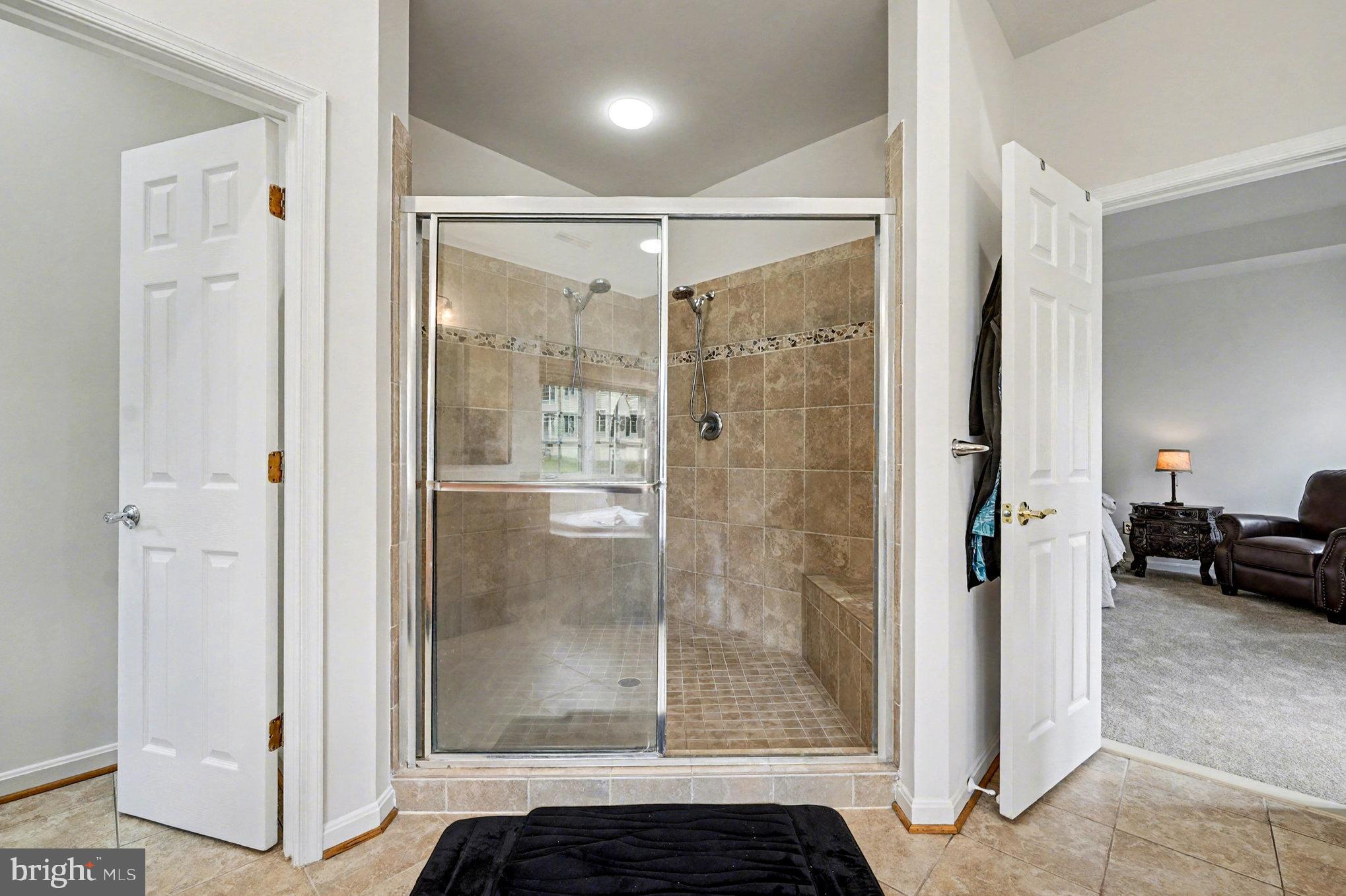 3320 McCorkle Court Triangle, VA 22172 - Photo 24 of 32 a bathroom with a glass shower door