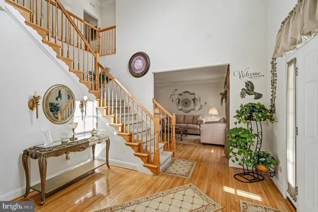 a view of an entryway with wooden floor