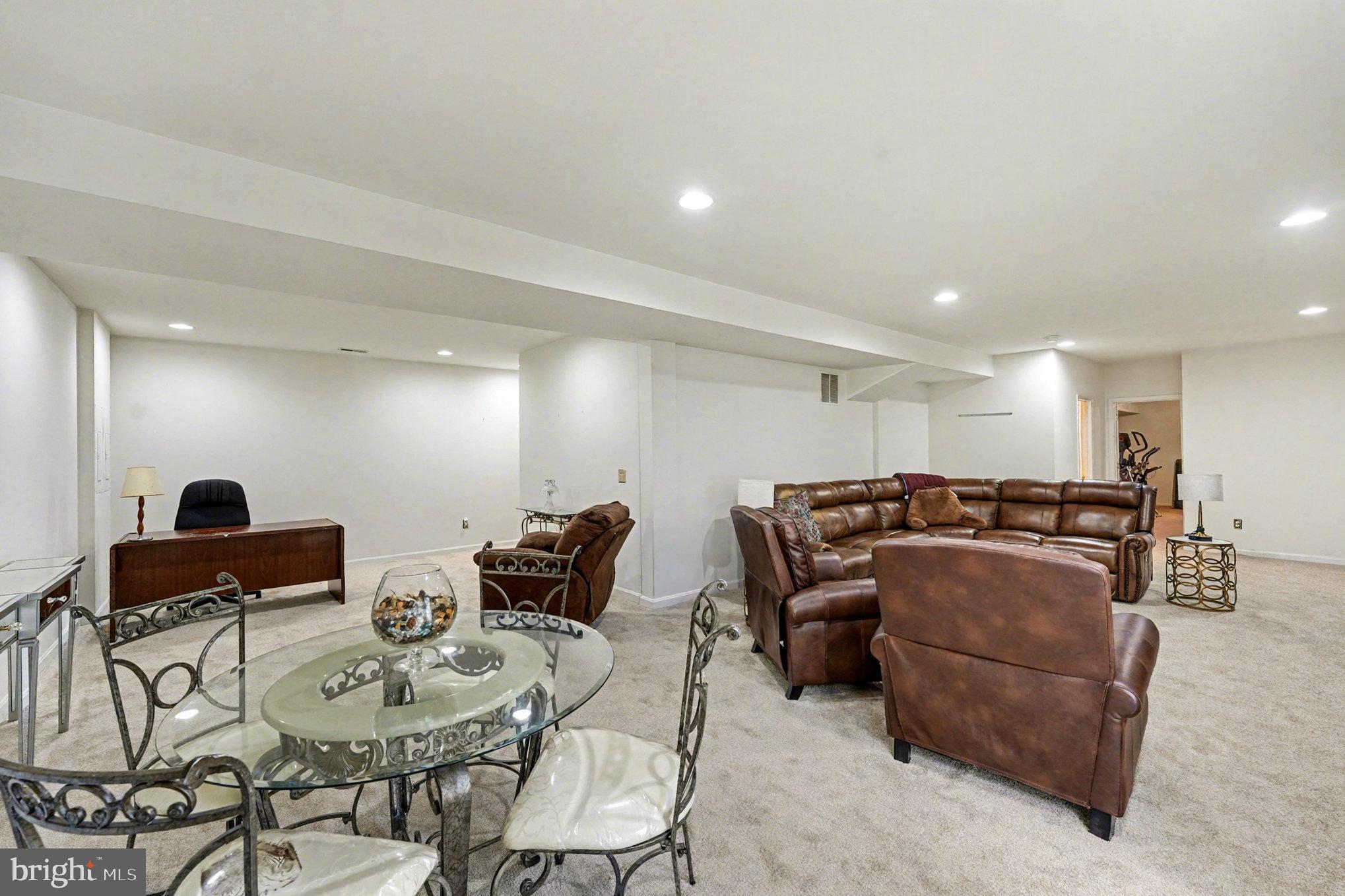 3320 McCorkle Court Triangle, VA 22172 - Photo 25 of 32 a living room with furniture a couch and kitchen view