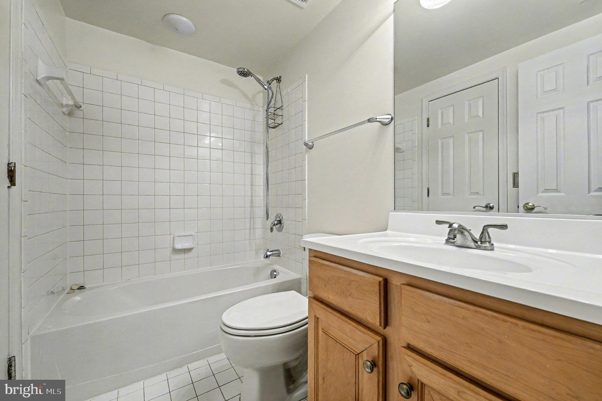 3320 McCorkle Court Triangle, VA 22172 - Photo 28 of 32 a bathroom with a sink a toilet and shower