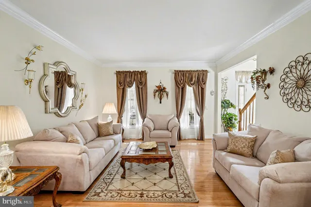 a living room with furniture or couch and a wooden floor