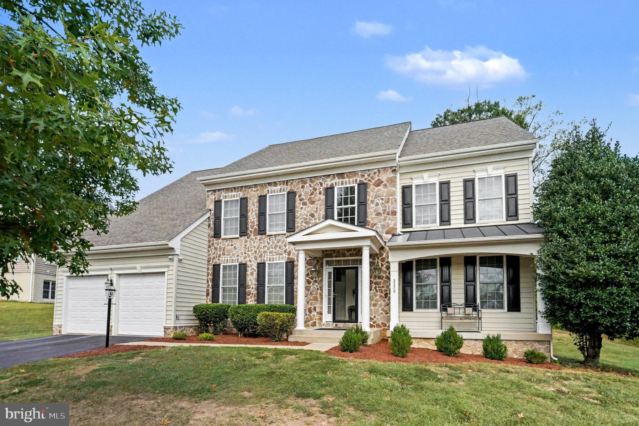 3320 McCorkle Court Triangle, VA 22172 - Photo 3 of 32 a front view of a house with a yard