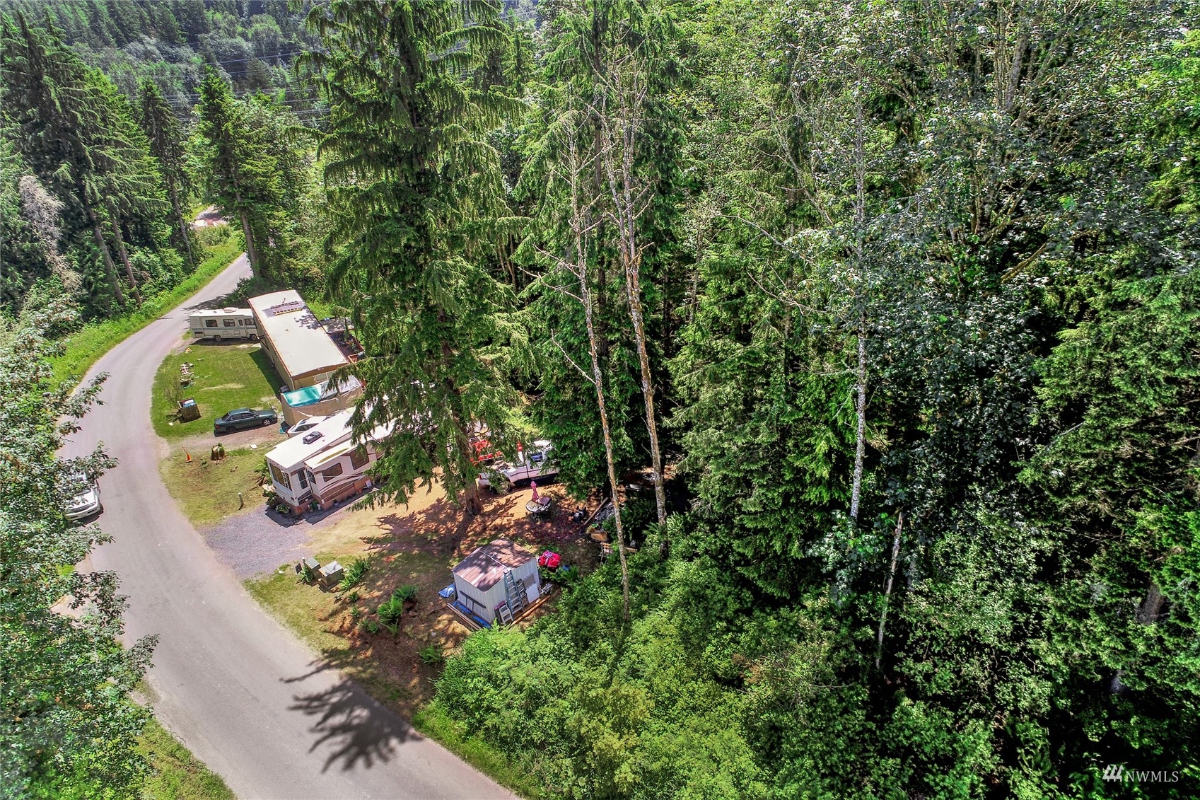 -xxxx Friar Creek Road Monroe, WA 98272 - Photo 6 of 13 an aerial view of a house with a yard and large trees