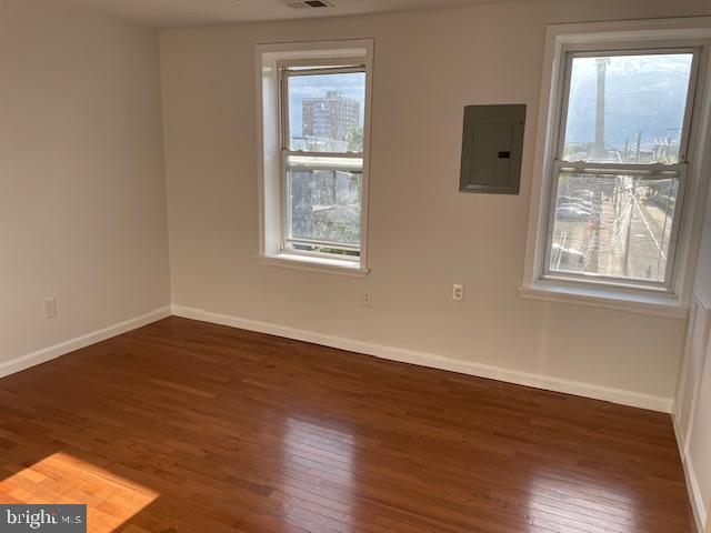 2154 Ridge Avenue, Unit 3 Philadelphia, PA 19121 - Photo 11 of 27 a view of an empty room with wooden floor and a window