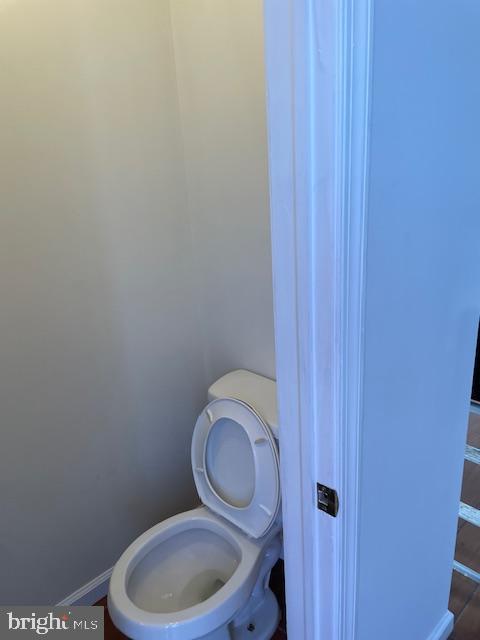 2154 Ridge Avenue, Unit 3 Philadelphia, PA 19121 - Photo 19 of 27 a white toilet sitting next to a wooden cabinet