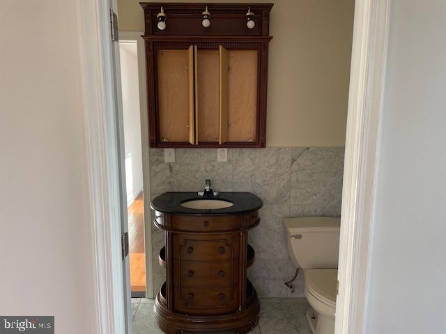 2154 Ridge Avenue, Unit 3 Philadelphia, PA 19121 - Photo 21 of 27 a view of a bathroom with a sink and a toilet