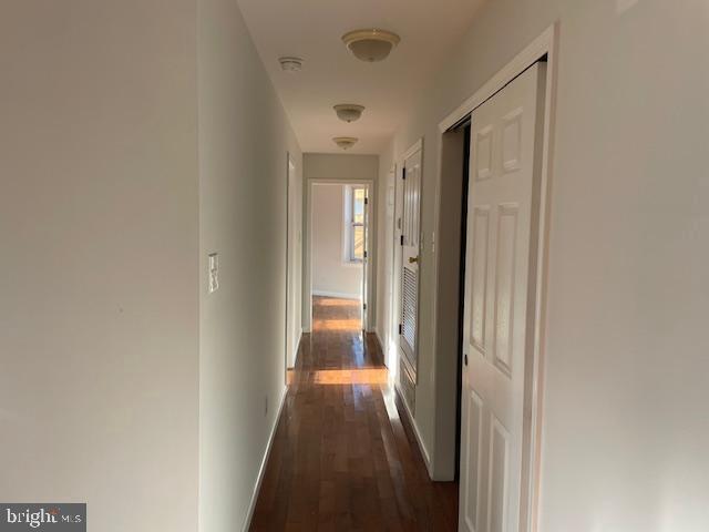 2154 Ridge Avenue, Unit 3 Philadelphia, PA 19121 - Photo 8 of 27 a view of a hallway with wooden floor and a bathroom