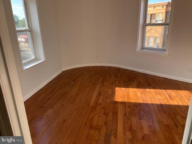 2154 Ridge Avenue, Unit 3 Philadelphia, PA 19121 - Photo 9 of 27 a view of an empty room with wooden floor and a window
