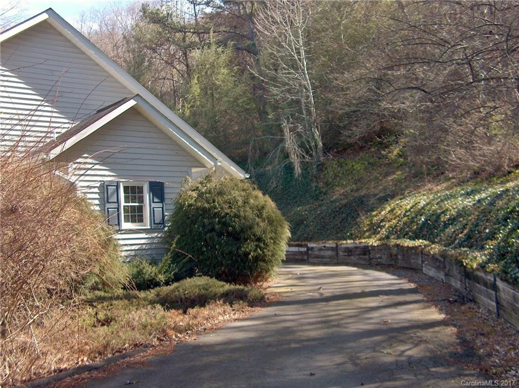 48 Falling Spring Road Clyde, NC 28721 - Photo 5 of 24 a view of house with backyard and trees