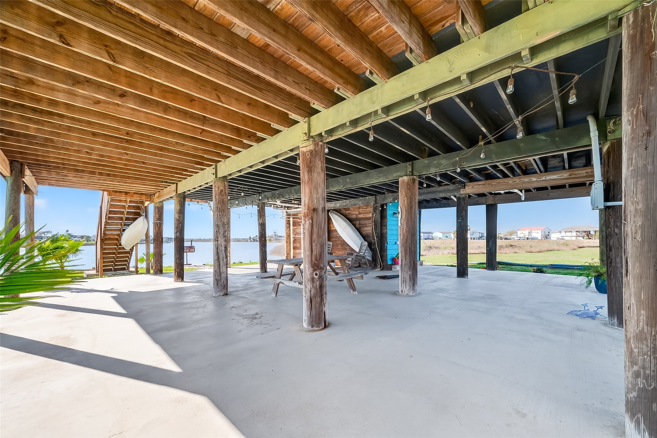 154 Poop Deck Lane Freeport, TX 77541 - Photo 24 of 32 First Floor covered Patio with 1/2 bath and outdoor shower overlooking water
