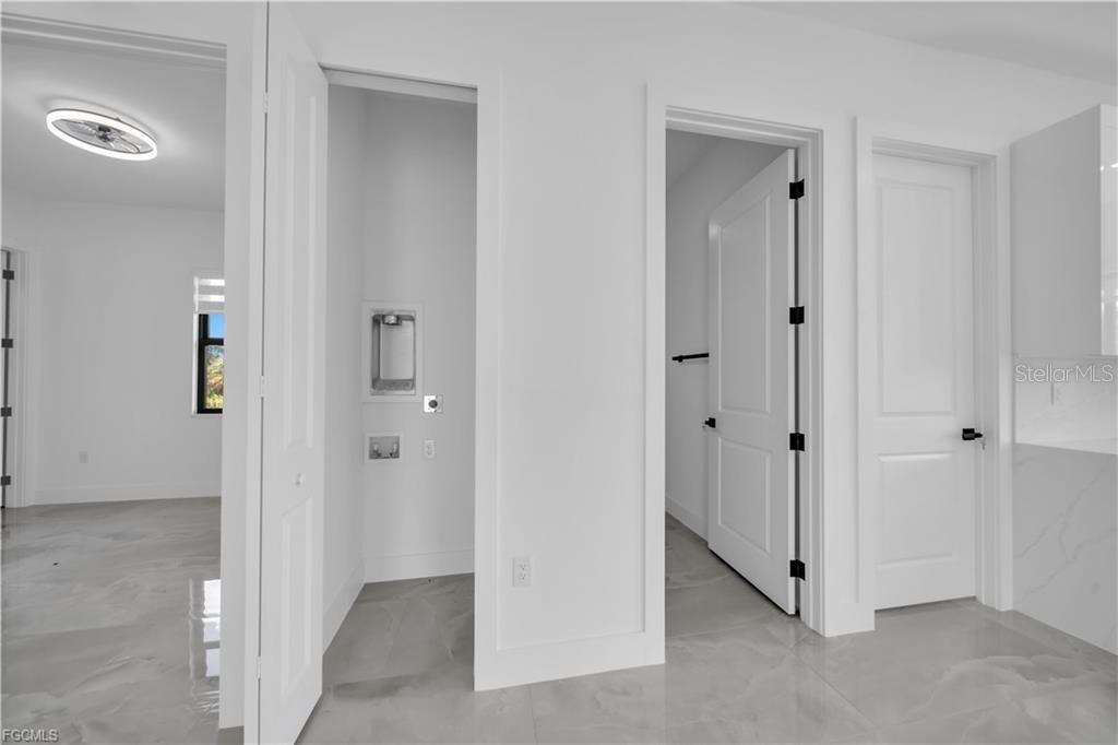 713 Roma Avenue South Lehigh Acres, FL 33974 - Photo 14 of 38 a view of an empty room with closet and mirror