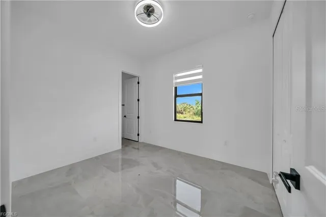 a view of a room with a large window