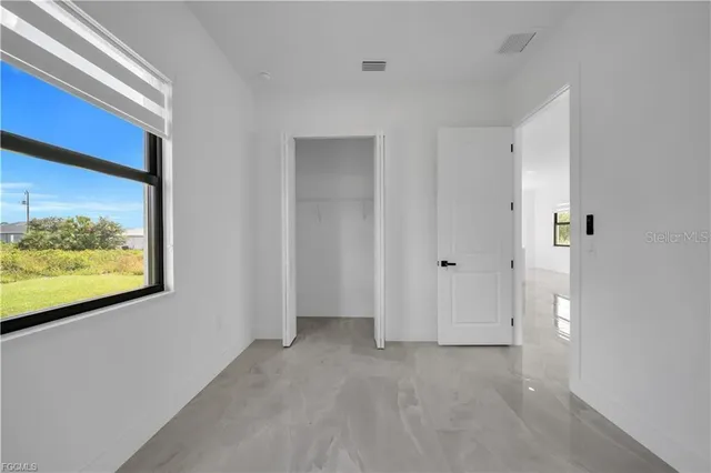 a bathroom with a sink mirror toilet shower and vanity