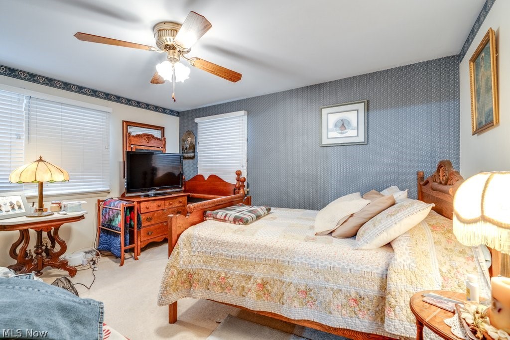 5981 Wiclif Road Northeast Canton, OH 44721 - Photo 28 of 50 Bedroom featuring light carpet, a ceiling fan, and wallpapered walls