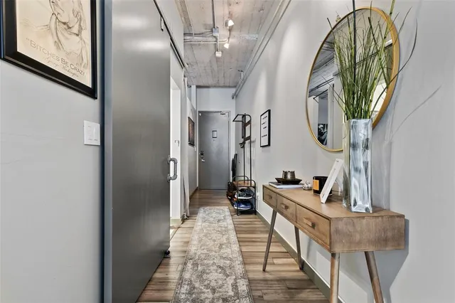 a view of hall way with furniture