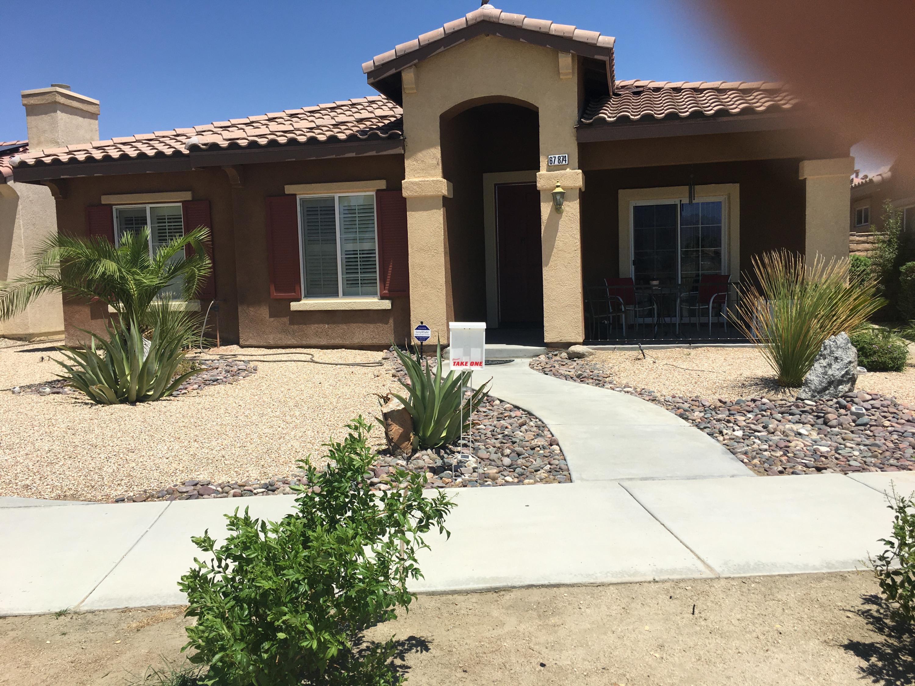 67874 Rio Largo Road Cathedral City, CA 92234 - Photo 1 of 20 a front view of a house