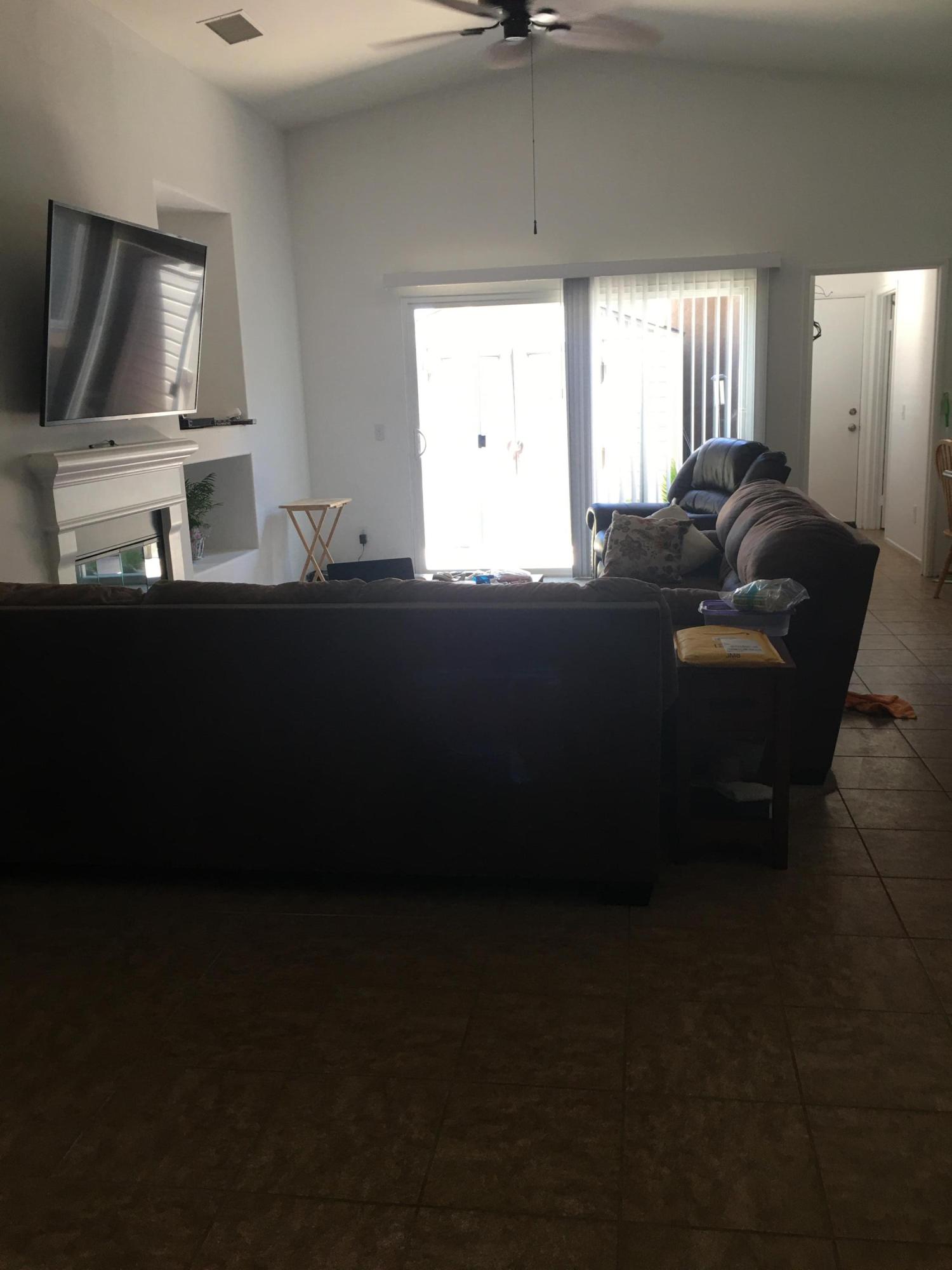 67874 Rio Largo Road Cathedral City, CA 92234 - Photo 14 of 20 a living room with furniture and a flat screen tv