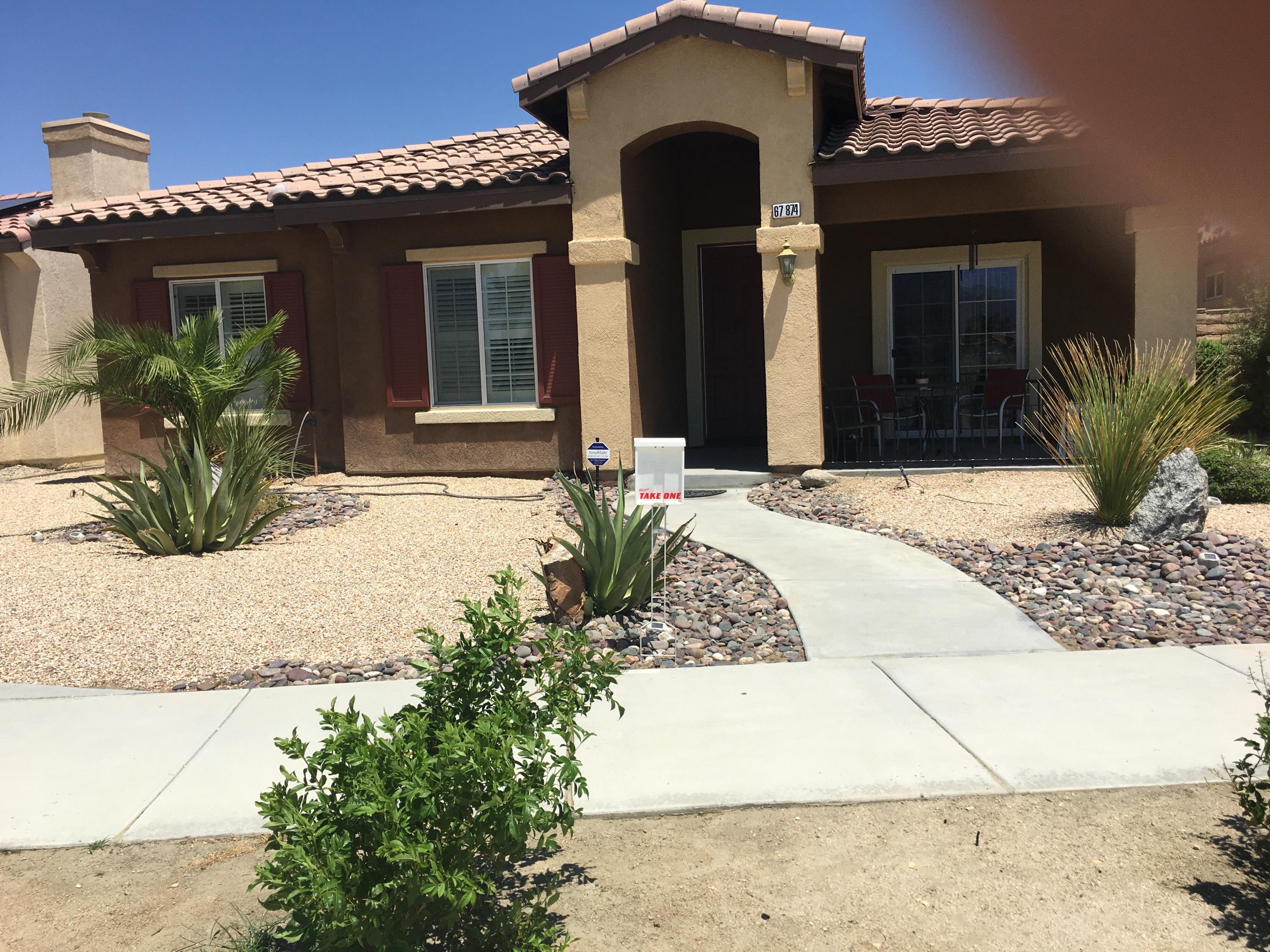 67874 Rio Largo Road Cathedral City, CA 92234 - Photo 4 of 20 a front view of a house