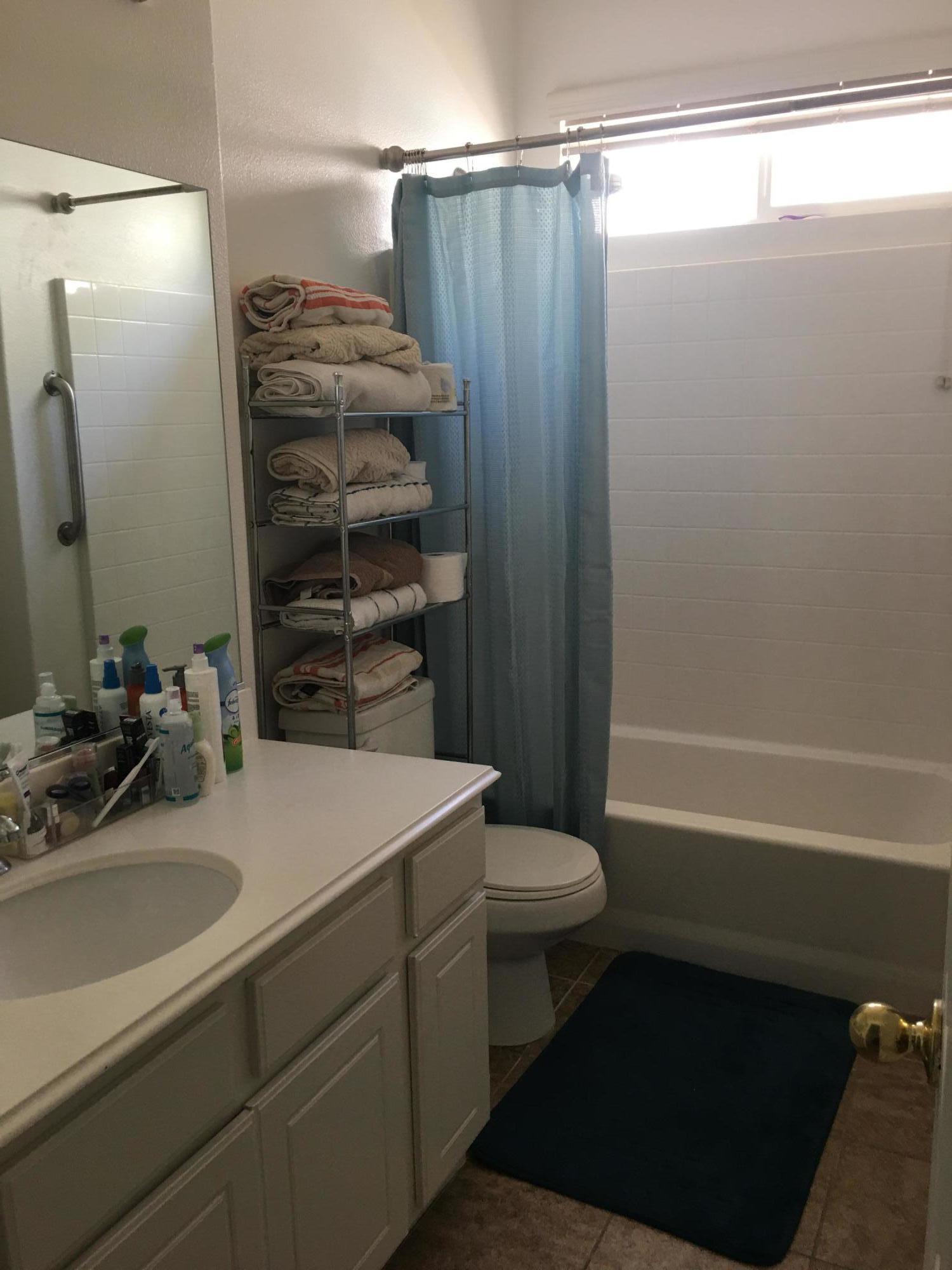 67874 Rio Largo Road Cathedral City, CA 92234 - Photo 9 of 20 a bathroom with a sink a toilet and shower