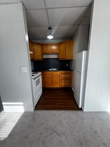 a kitchen with stainless steel appliances a refrigerator and a stove
