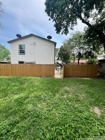 a backyard of a house with lots of green space
