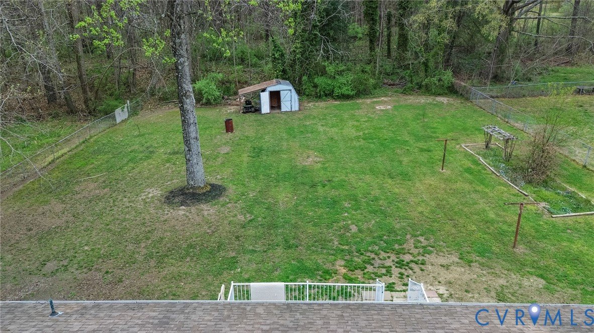 5904 Sutherland Drive Sutherland, VA 23885 - Photo 19 of 20 a view of a tiny house with a yard