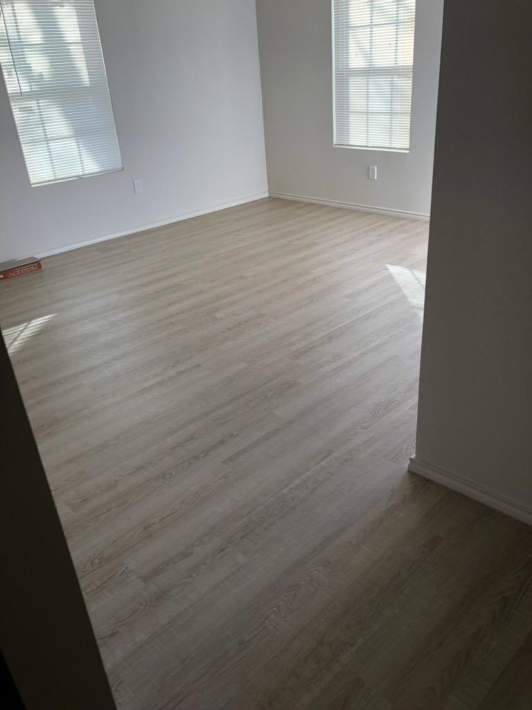1724 27th Street Lubbock, TX 79411 - Photo 3 of 7 an empty room with windows