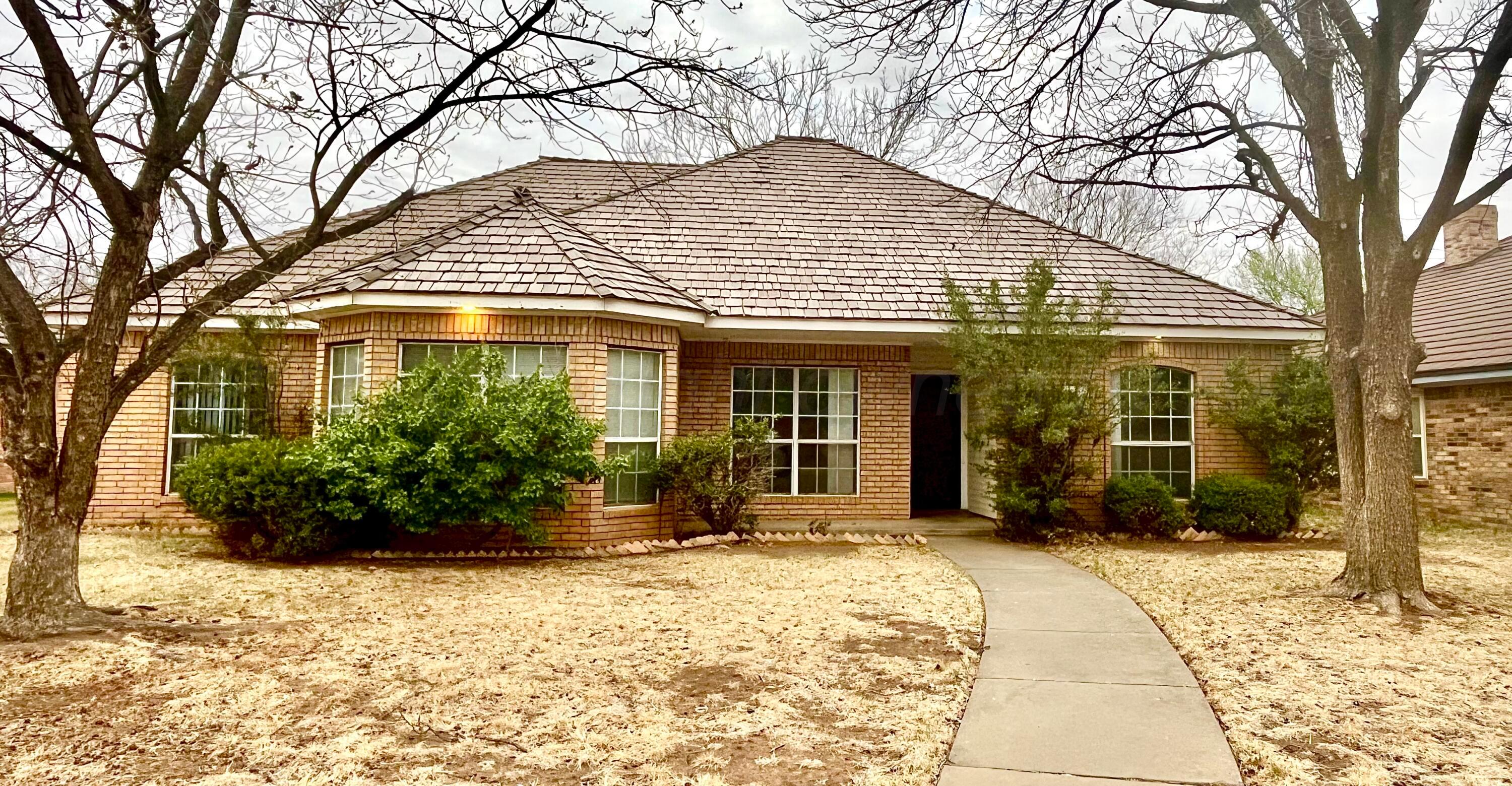 7628 Catskill Avenue Amarillo, TX 79121 - Photo 1 of 16 a front view of a house with a yard